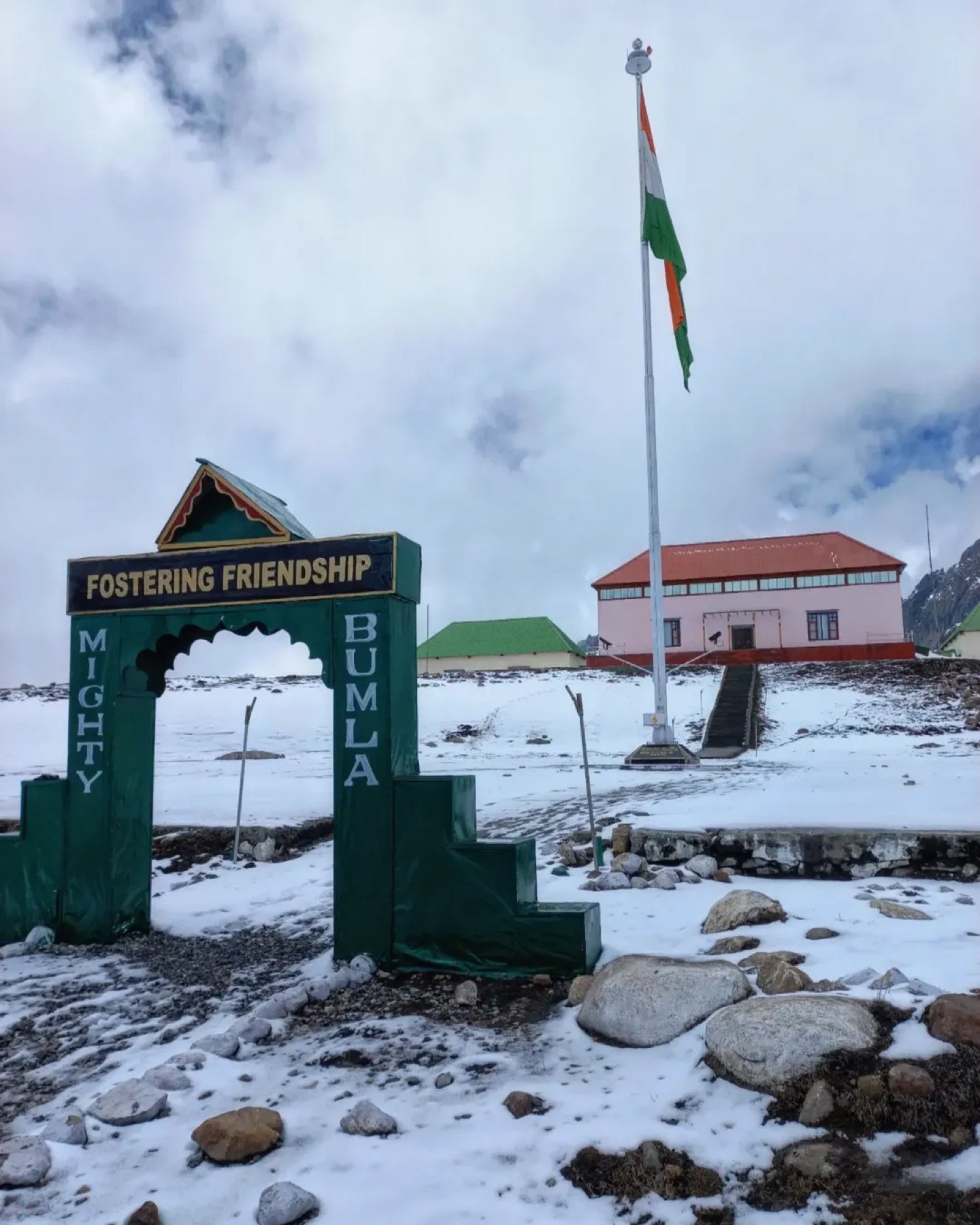 Bum La Pass at 15,200 ft &mdash; the 'Mighty Bumla, Fostering Friendship' gate, Indian flag and snow