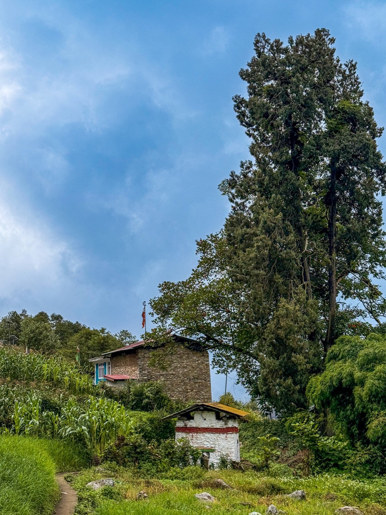 A traditional Monpa home in a village near Hotel Taktsang &mdash; stone and timber with a small family chorten in the garden