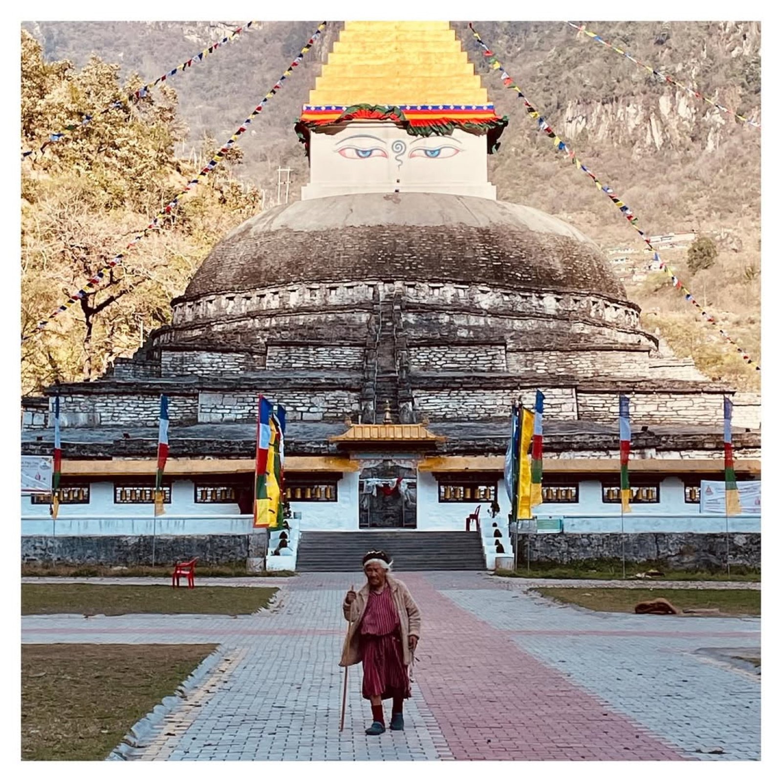 Gorsam Chorten at Zemithang &mdash; the ancient white stupa with an elderly Monpa pilgrim